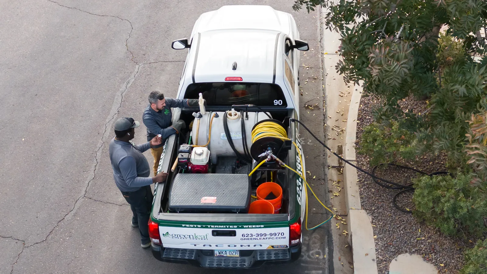 Greenleaf technicians preparing to provide a pest treatment